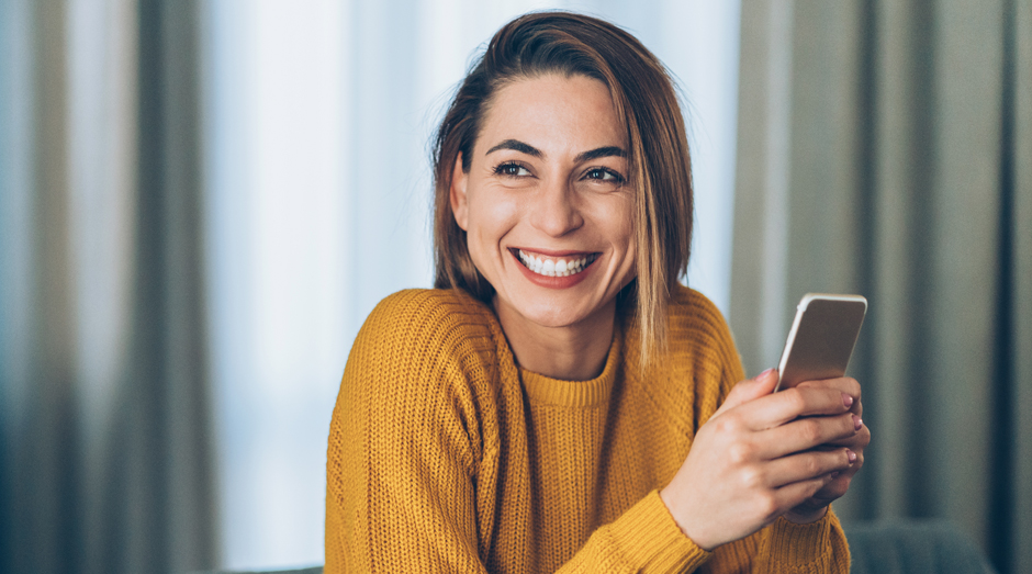 Happy person with a smartphone